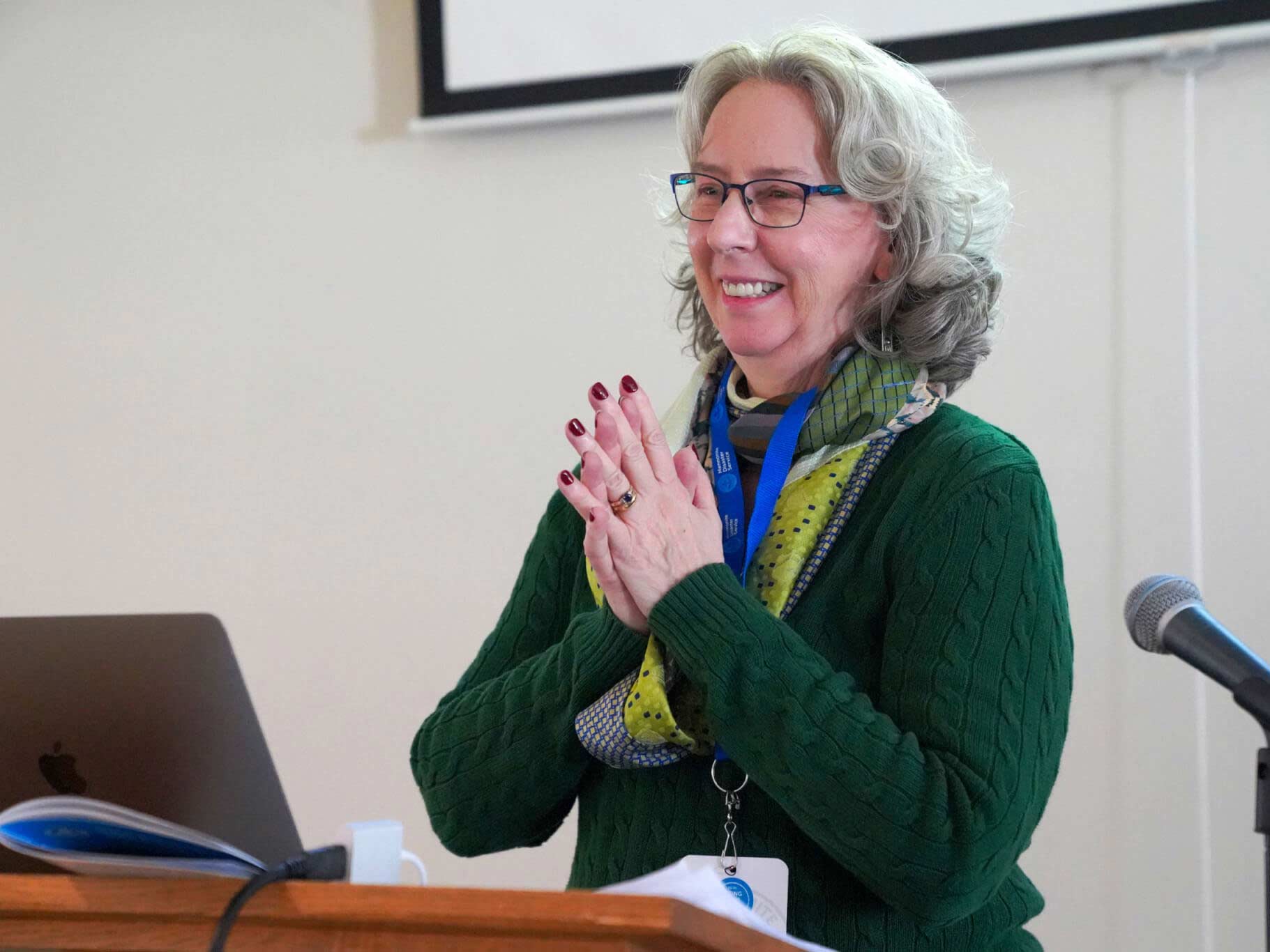 A photo of a women presenting at a past MDS annual celebration.