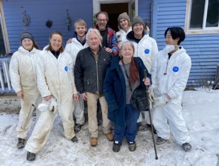 Danie and Dian Brooks (centre) with James Toews (centre rear) and volunteers from Columbia Bible College and the Chinatown Peace Church in white Tyvek disposable coveralls.