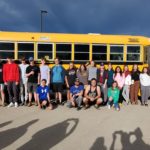 Monte Lake group photo in front of a yellow school bus