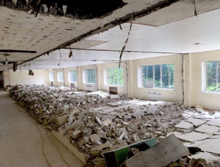 Demolition at Goshen College in preparation of new nursing facility. Concrete ruble scatters the floor.
