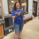 Gabby, MDS Volunteer Training Coordinator, holds a baby alligator!