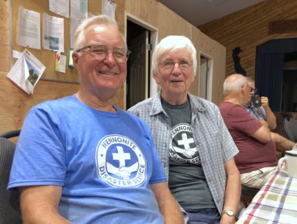 MDS Volunteers, Grant and Joan, pose of a picture together at a dinning table in Monte Lake, B.C.