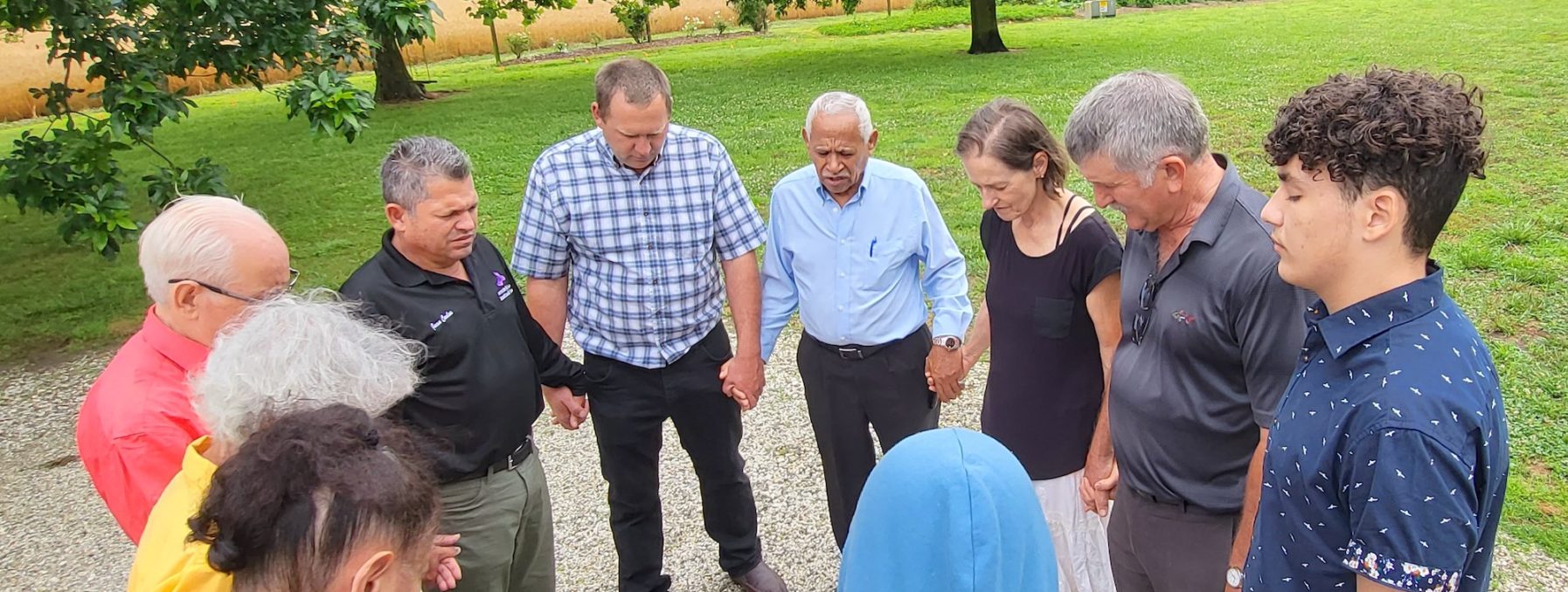 Group standing together in prayer
