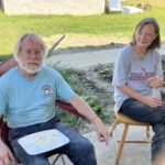 Jerry Hardt and Diane Yoder sit outdoors