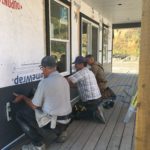 Ernie Falk, Royce Boskers, Gord Shea installing Siding at Peden Home