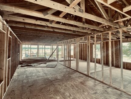 Interior picture of a home after getting framed with lumber. A few walls left to add particle board to.