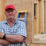 Wayne Roden in front of his new house, under construction by MDS volunteers. MDS photo/Nikki Hamm Gwala