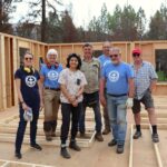 Wayne Roden (in red cap) stands in a new build home without a roof with an MDS volunteer crew in mid-May. MDS photo/Nikki Hamm Gwala