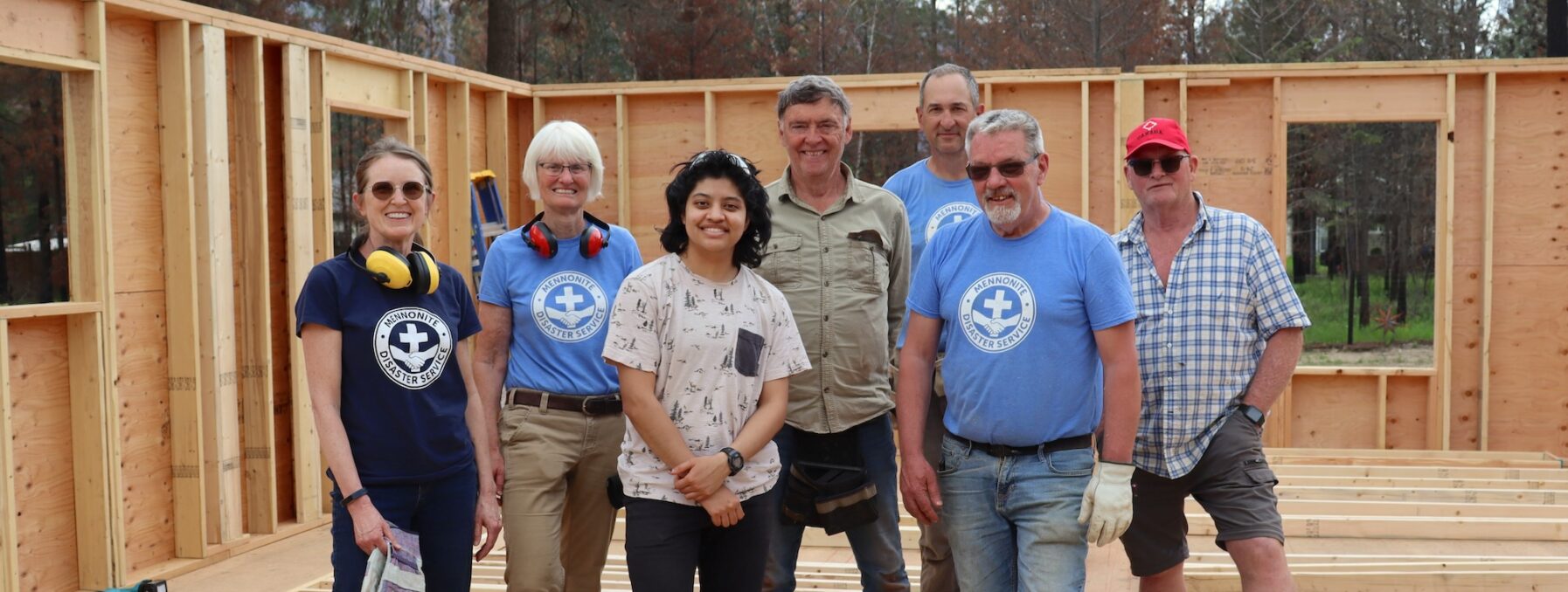 Wayne Roden (in red cap) stands in a new build home without a roof with an MDS volunteer crew in mid-May. MDS photo/Nikki Hamm Gwala