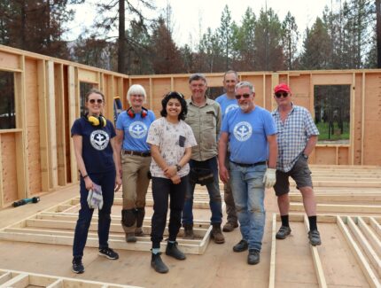 Wayne Roden (in red cap) stands in a new build home without a roof with an MDS volunteer crew in mid-May. MDS photo/Nikki Hamm Gwala