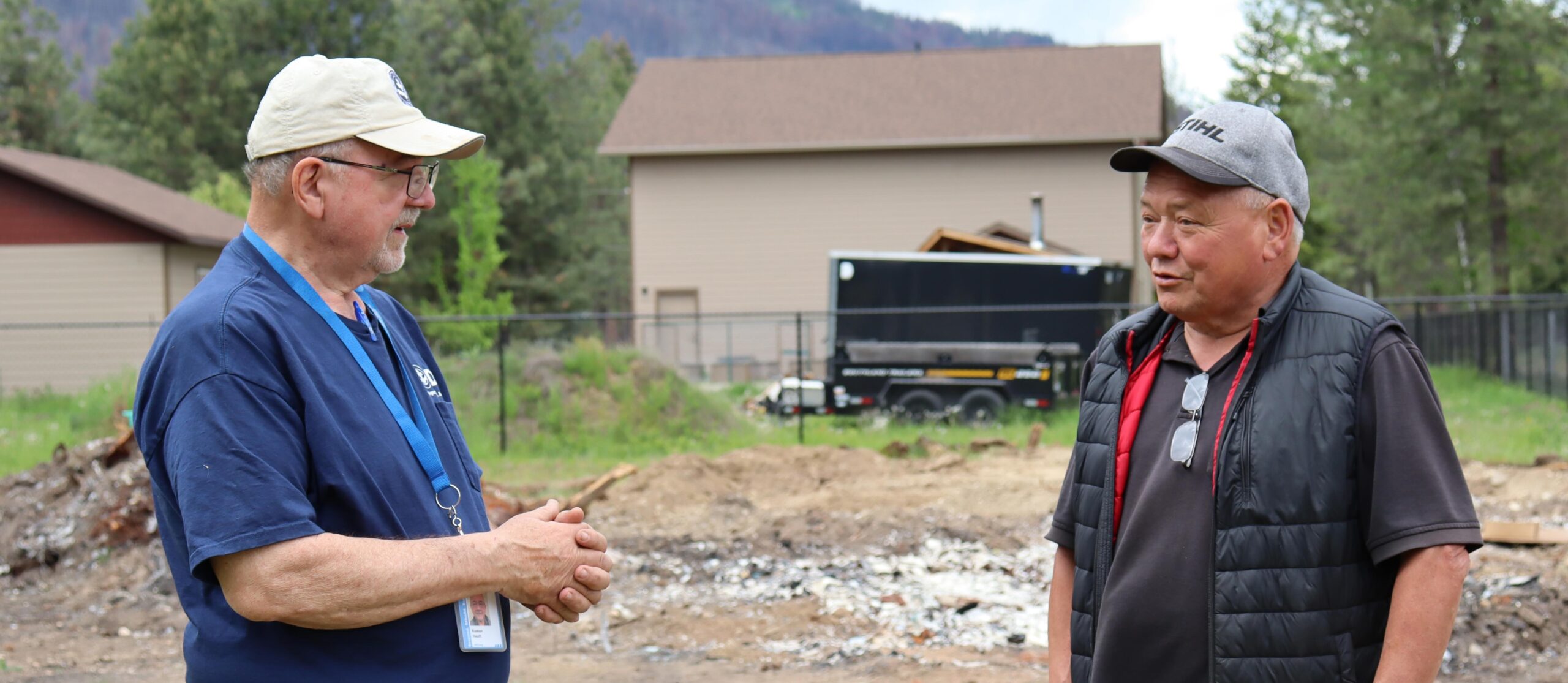 Ted Edbom (right) discusses siding, roofing and paint colours with Roman Heuft, a Shuswap Project Director. MDS photo/Nikki Hamm Gwala