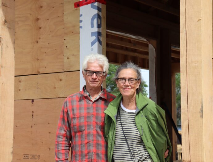 Owen Collings and Patsy Gessey outside their house, under construction by MDS volunteers in May 2024. MDS photo/Nikki Hamm Gwala