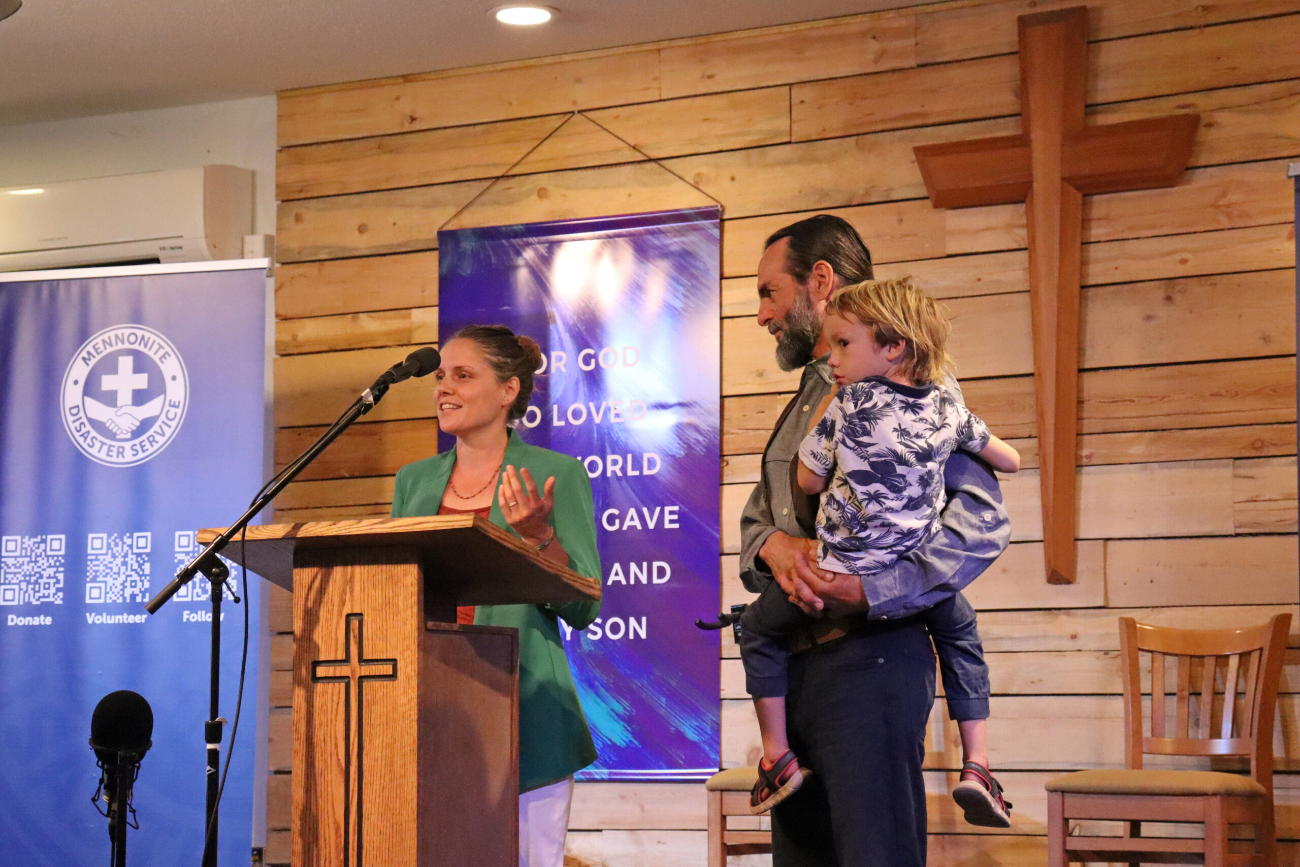 Isabelle Labelle, a homeowner from Celista, British Columbia, speaks at the MDS Shuswap Closing Celebration with her husband Jade Shamen and son Abel Shamen (4) to the right.MDS photo/Nikki Hamm Gwala