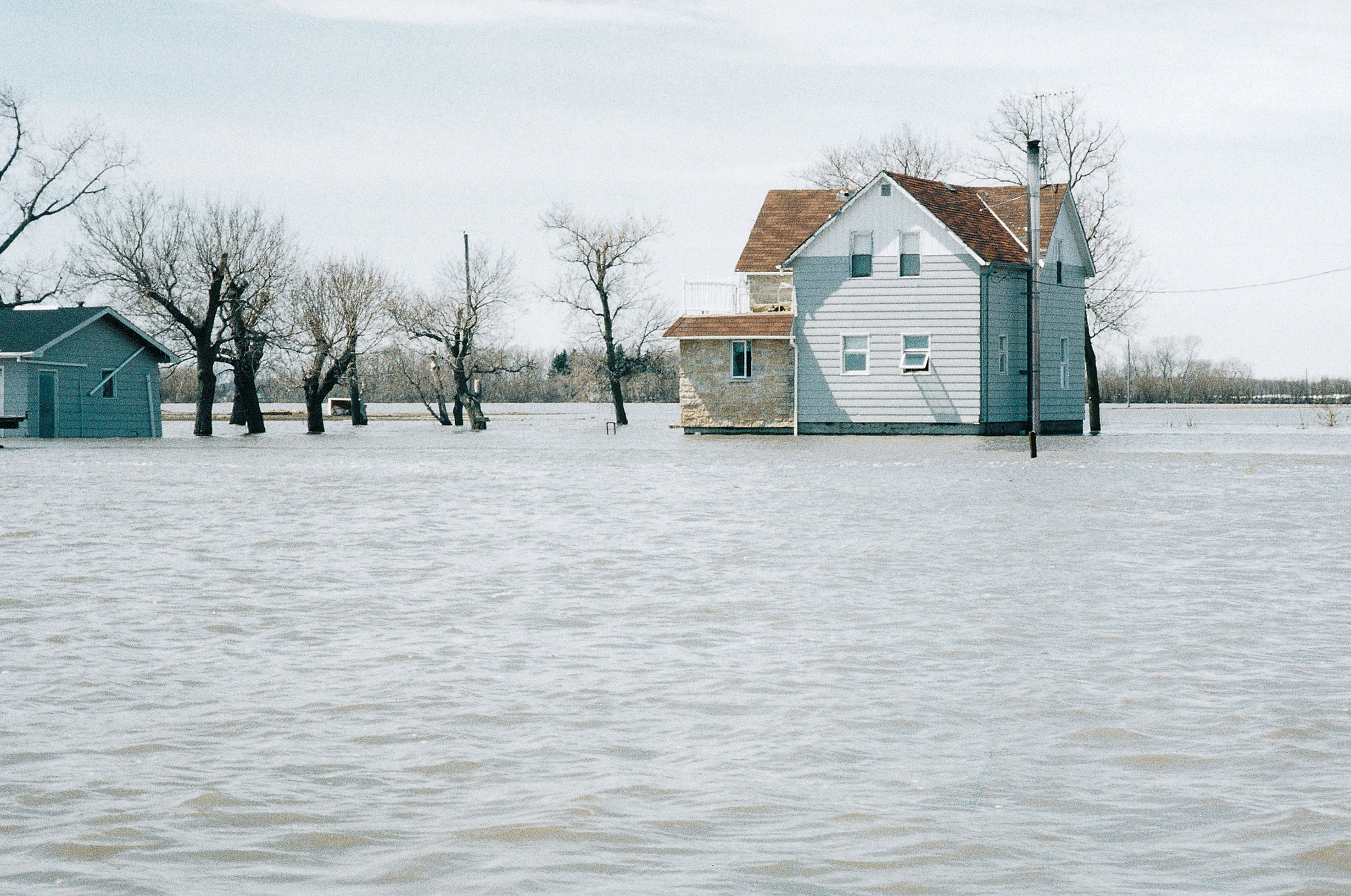 1997 Red River flood damage to a rural home and property in southern Manitoba.