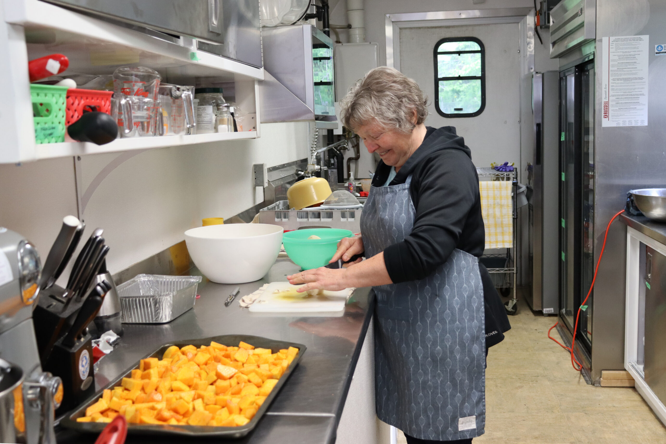 A woman chops vegetables