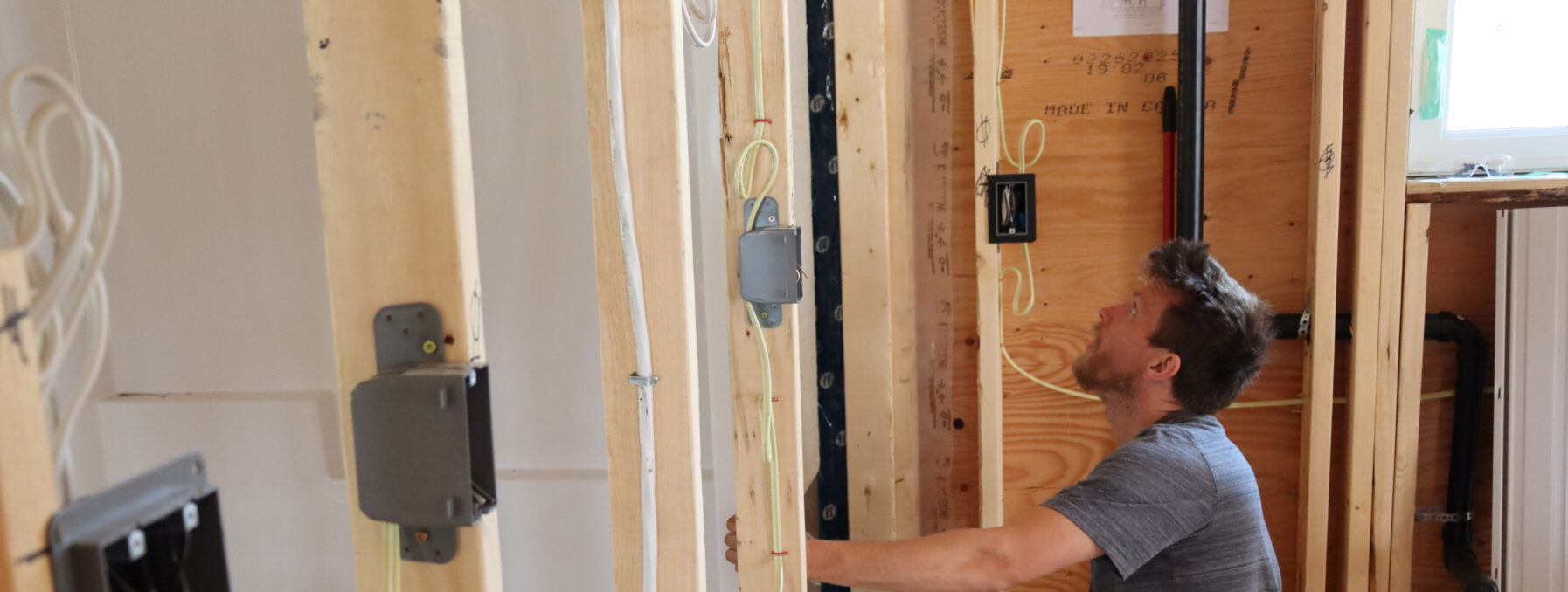 A man installs a bathtub