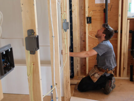 A man installs a bathtub