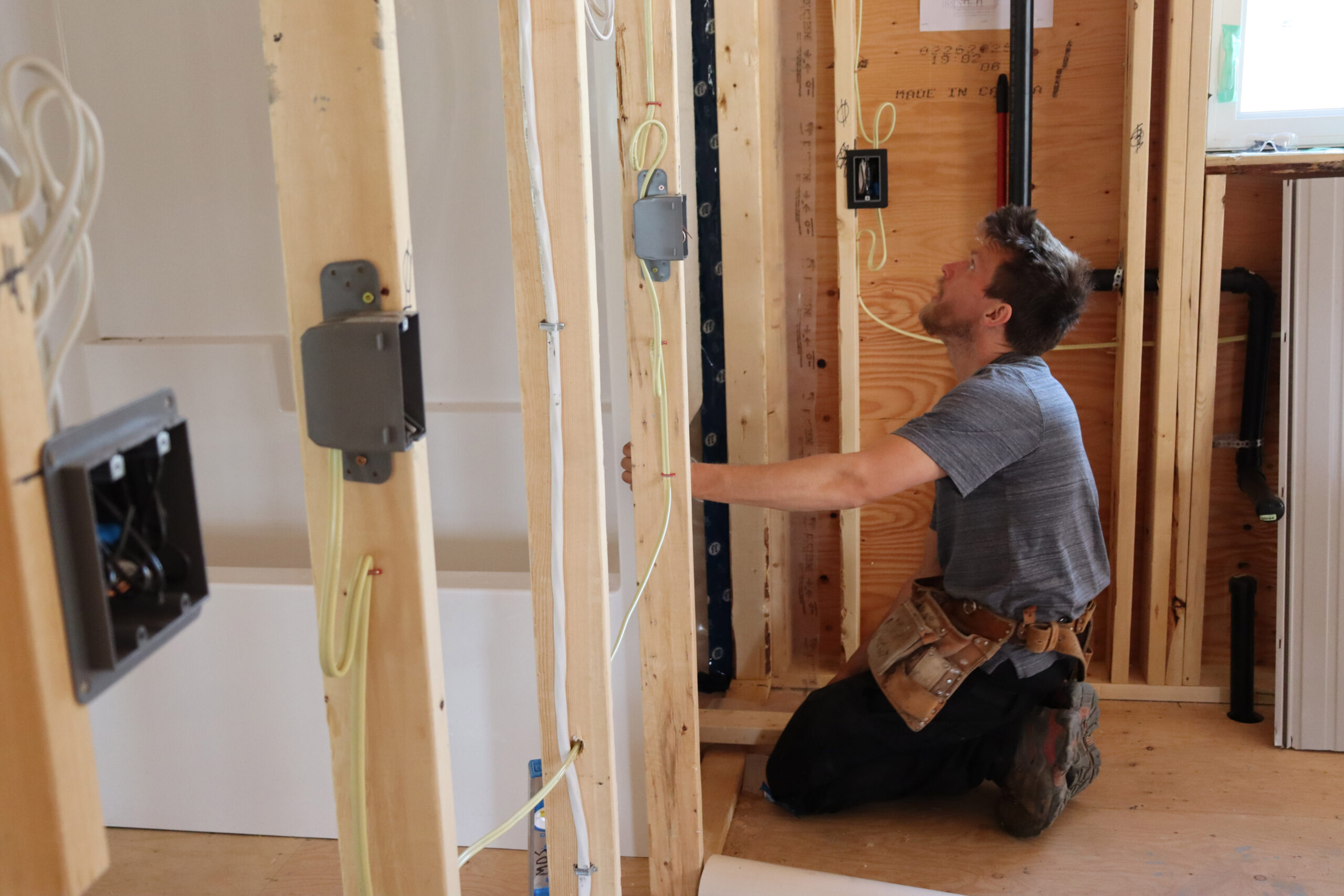 A man installs a bathtub