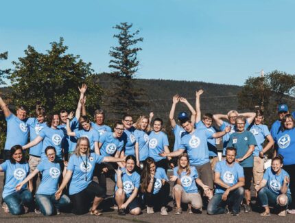Kinection Hero Image for MDS Story. Image of a volunteer group in matching blue shirts.