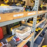 Construction tools on shelves.