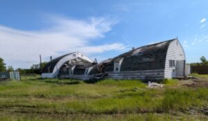 Damaged Quonset-style building.