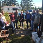 Group standing outside by a house.