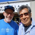 Two men posing together for a picture.