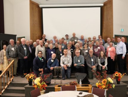 Group of people posing for picture.